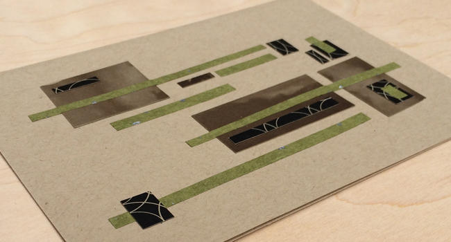 Card with brown background and green, black, and brown elements